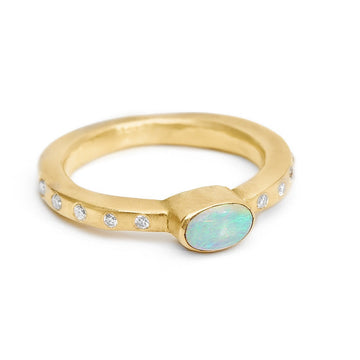 Oval Fiery Opal Set in 18kt recycled yellow gold square band with side diamonds. A beautiful alternative engagement ring or additional to any ring stack. 