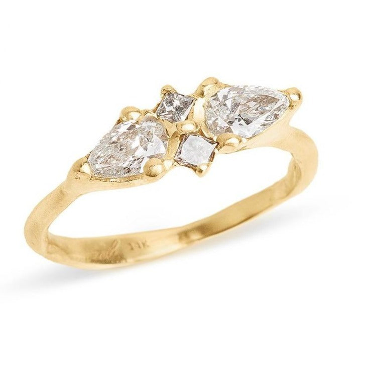 Double pear multi stone diamond engagement ring set in yellow gold organic handmade setting.