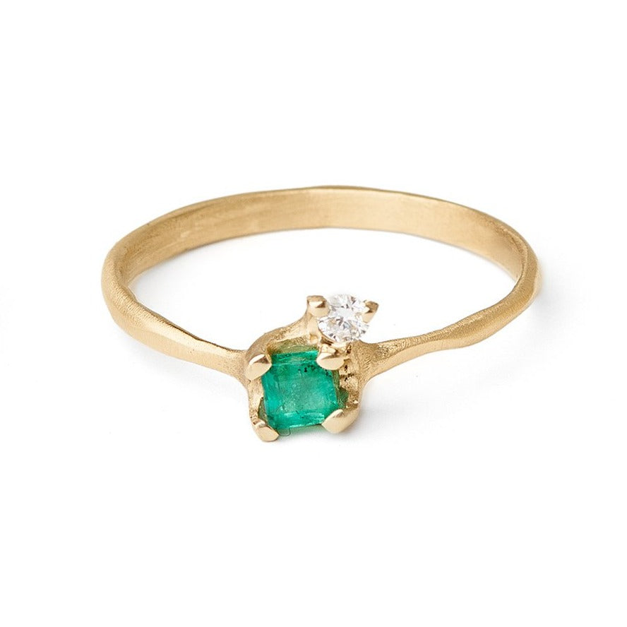  Pale emerald and diamond ring set in gold.  Ethically sourced emerald and diamond rings unique settings for emeralds. Alternative engagement rings 