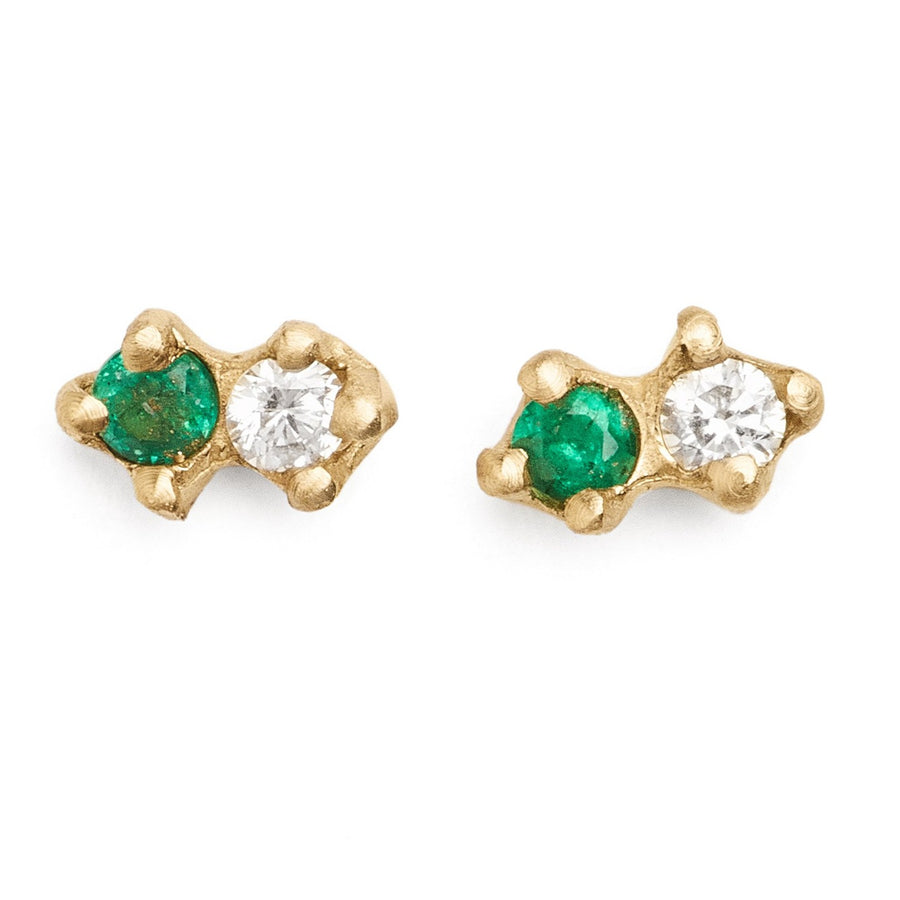 white diamond and emerald earrings in gold. tiny everyday studs