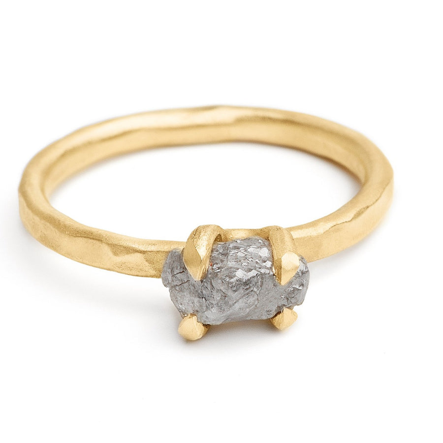 Rough grey diamond ring set in 14kt hammered yellow gold ring prong setting
