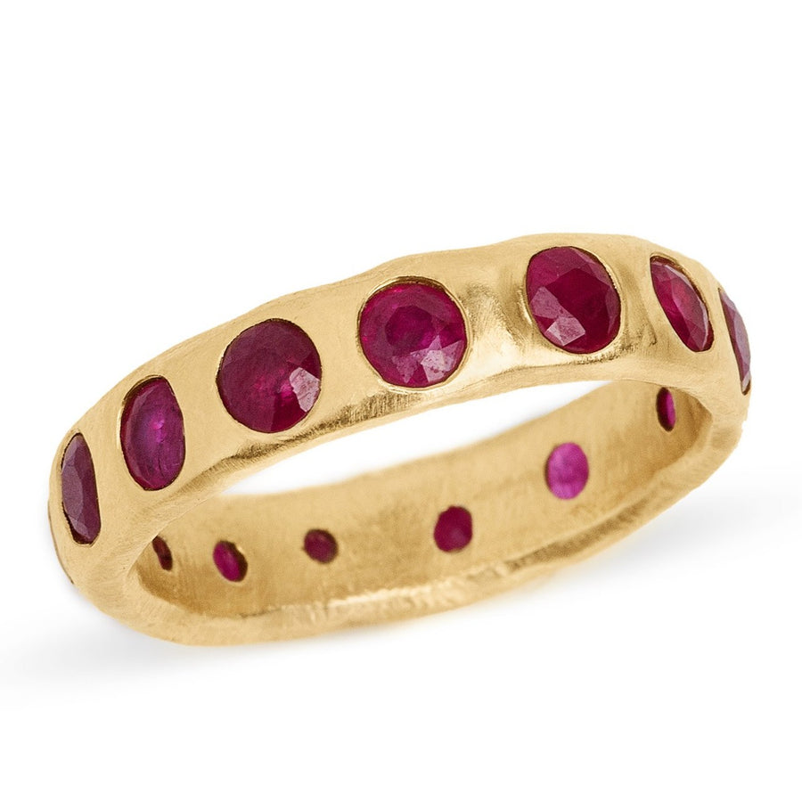 Ruby eternity band set in 14kt yellow gold wide ruby band.