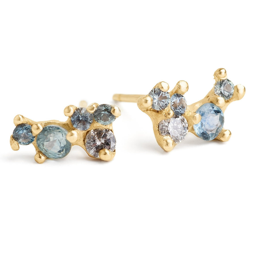 Gemstone cluster studs hand-made in Brooklyn. Montana Sapphires and grey diamond cluster stone earrings set in 14kt yellow gold 