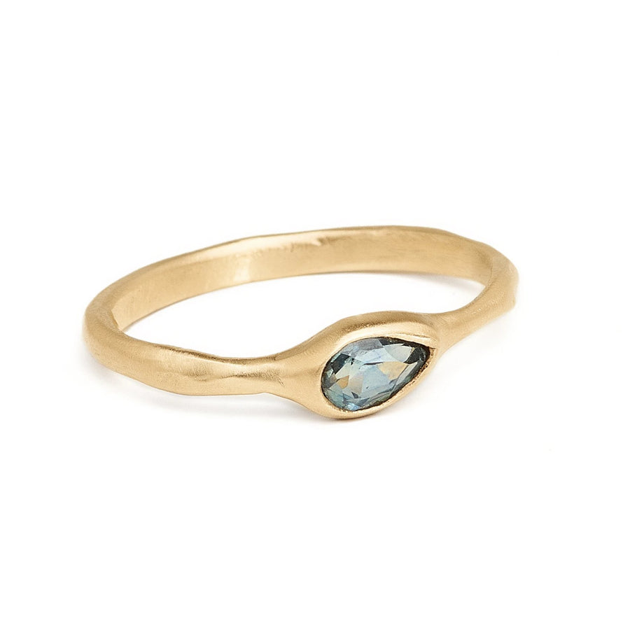 Pear shaped teal Montana sapphire delicate gold ring. Simple inexpensive alternative engagement ring. 
