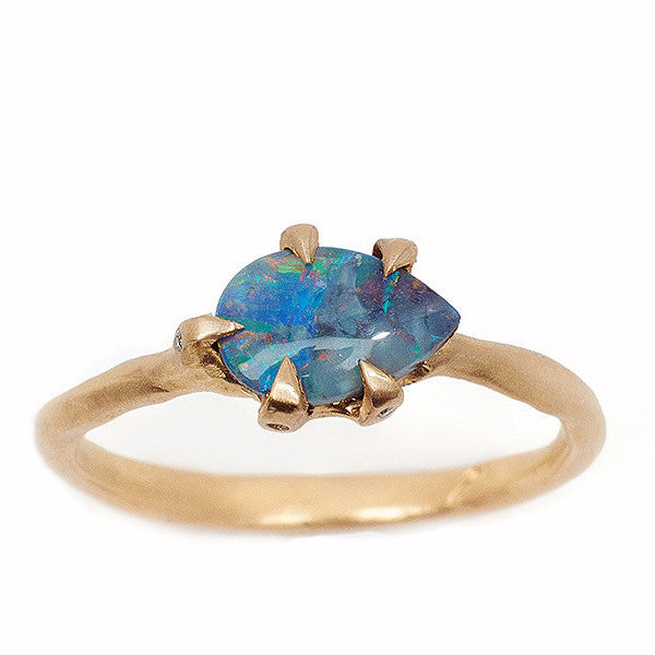 Blue pear shaped opal ring set in 14kt yellow gold with handmade setting 