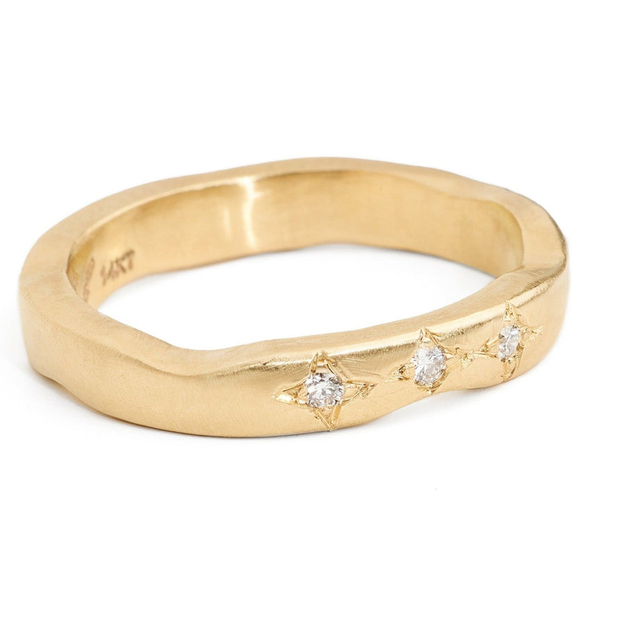 curved recycled gold wedding band  with three star set pave diamonds. Perfect for stacking