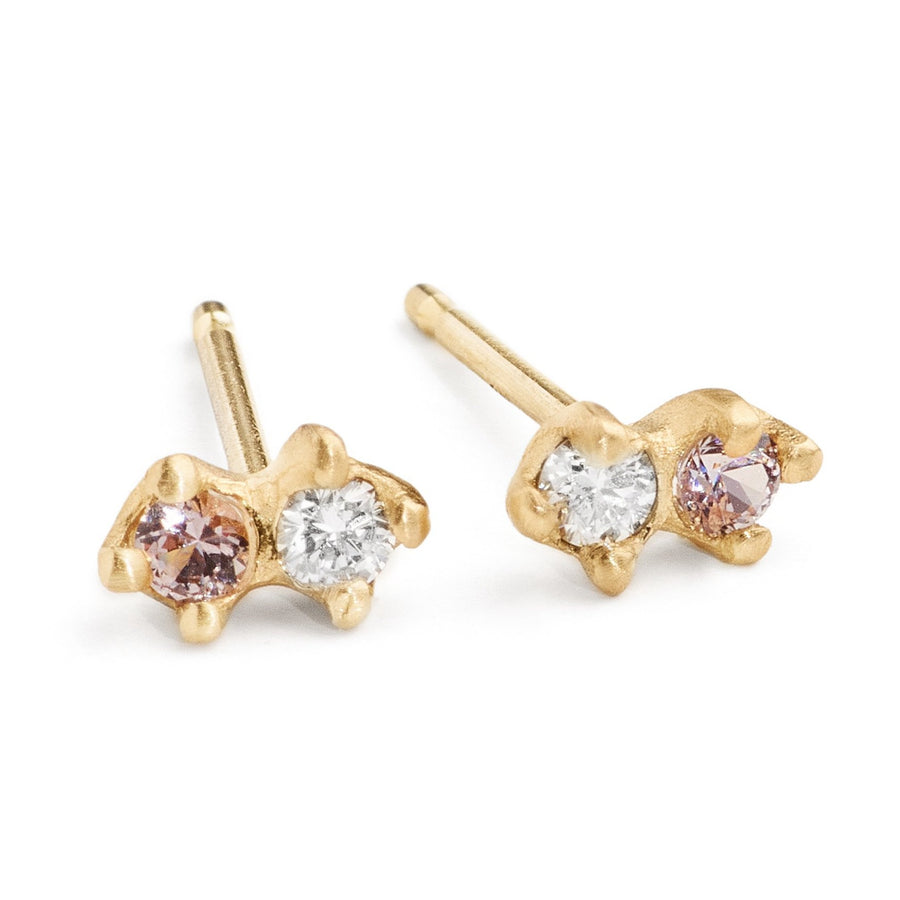 Small diamond studs for multiple piercings. white diamond and purple spinel set in yellow gold 