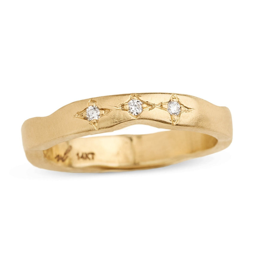 Pave star set diamonds in a gently wavy  recycled gold wedding band. 