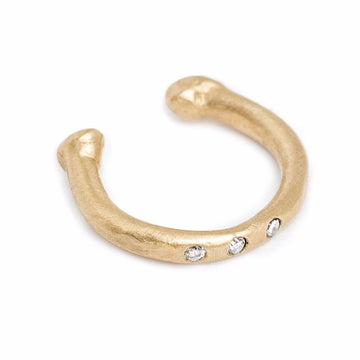 14kt yellow gold ear-cuff with three diamonds. Diamond ear-cuff earring