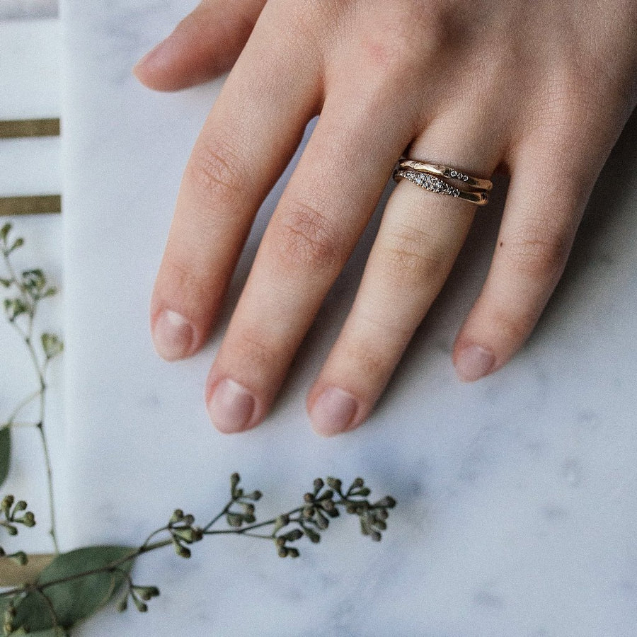 14kt recycled gold and diamond wedding bands. Grey reclaimed diamonds organic shape fits well with any engagment ring