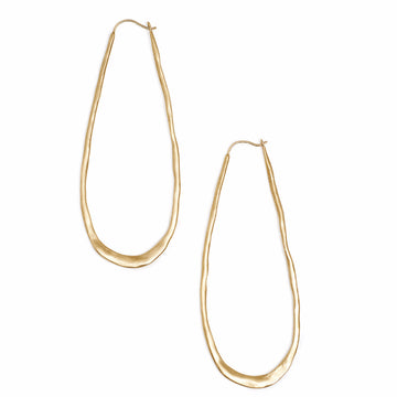 Long oval gold hoop earrings with a hammered texture 
