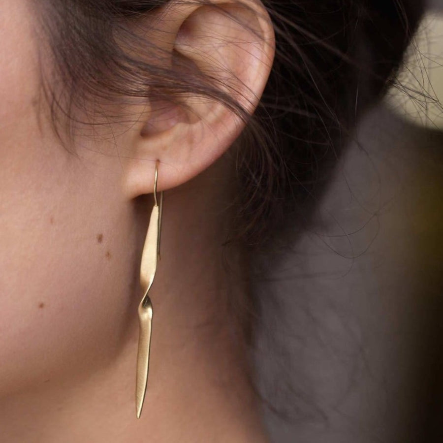 Gold long dangle earrings with dagger like point. Adds an elegant edge 