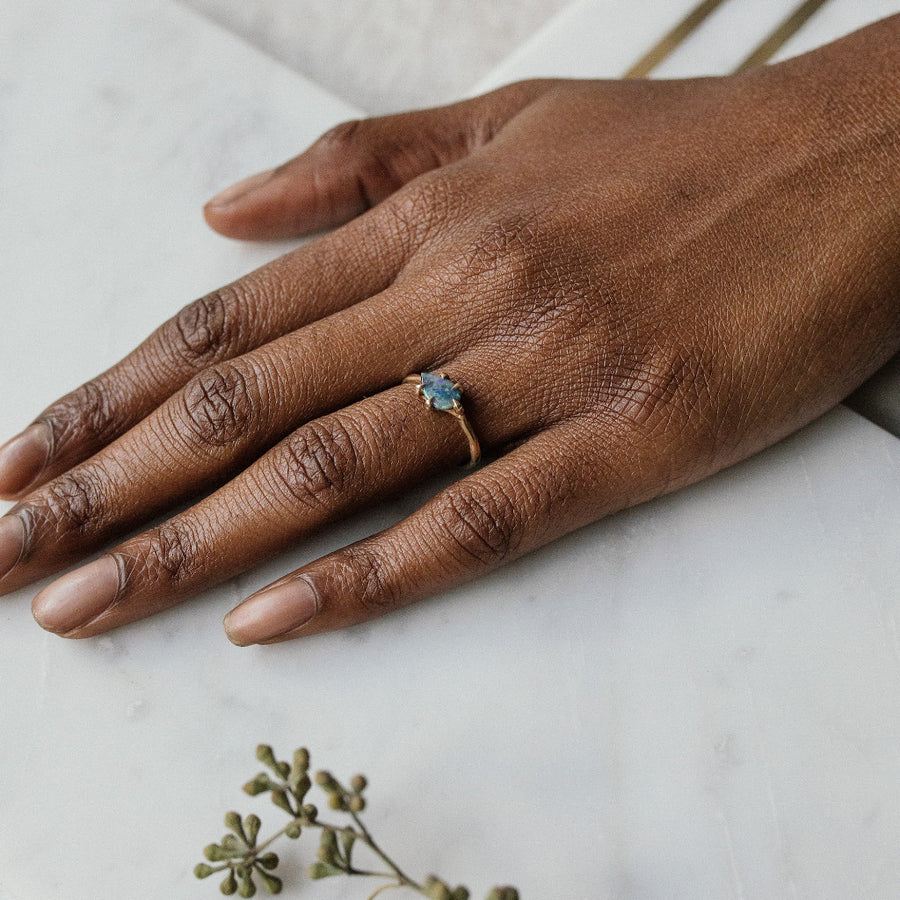 Beautiful delicate opal ring set in yellow gold