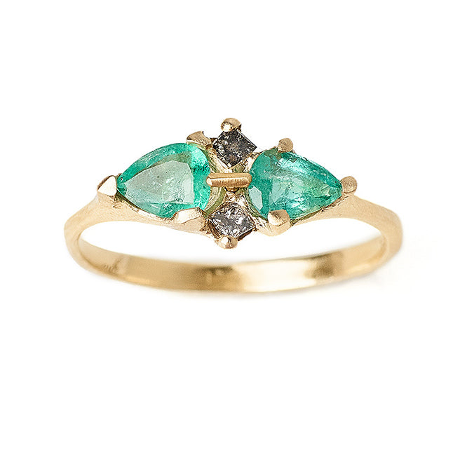 Pale pear shaped emeralds and grey diamond multi-stone engagment ring