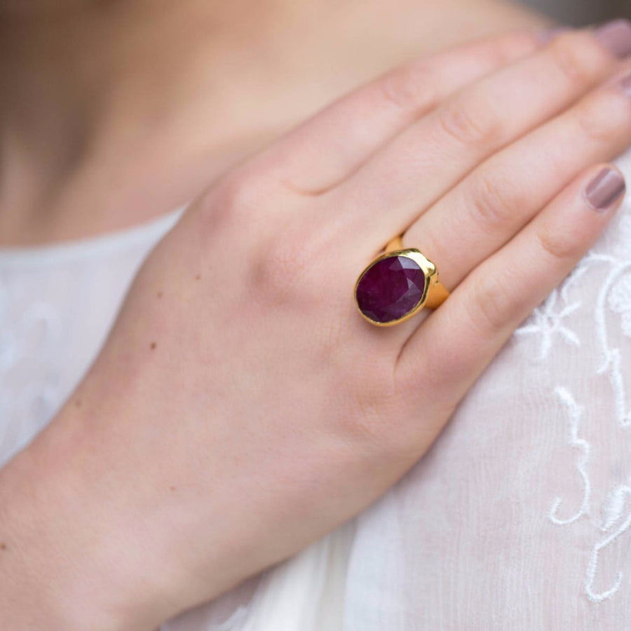 Ruby gold statement ring with snake and black diamond eye detail 