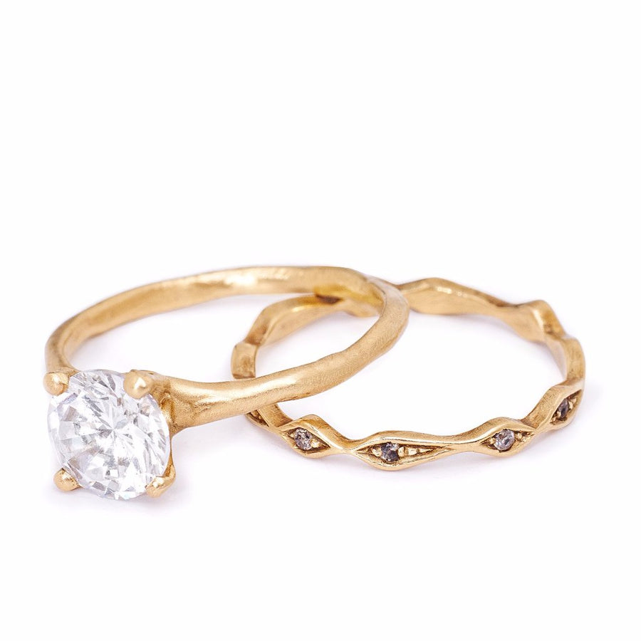 Round diamond engagment ring and grey diamond pave set wedding band