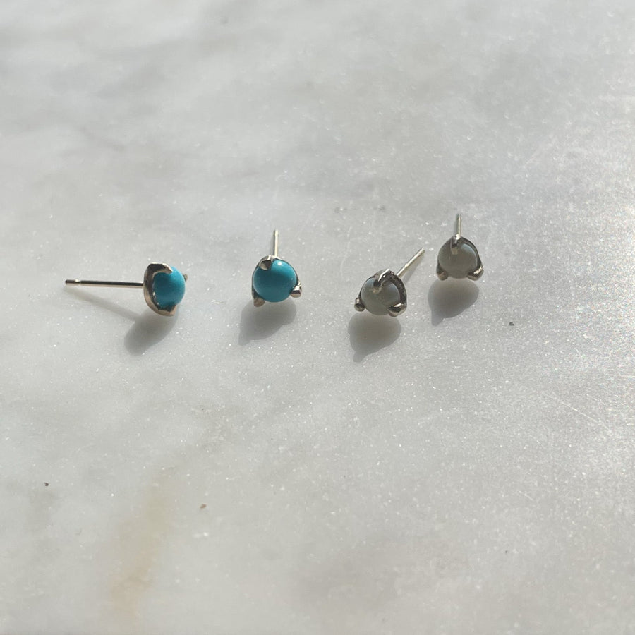 Robins egg blue Turquoise stud earrings set in a handmade 14kt gold prong setting. Sleeping Beauty Turquoise earrings made in Brooklyn 