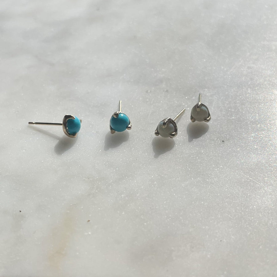 Robins egg blue Turquoise stud earrings set in a handmade 14kt gold prong setting. Sleeping Beauty Turquoise earrings made in Brooklyn 